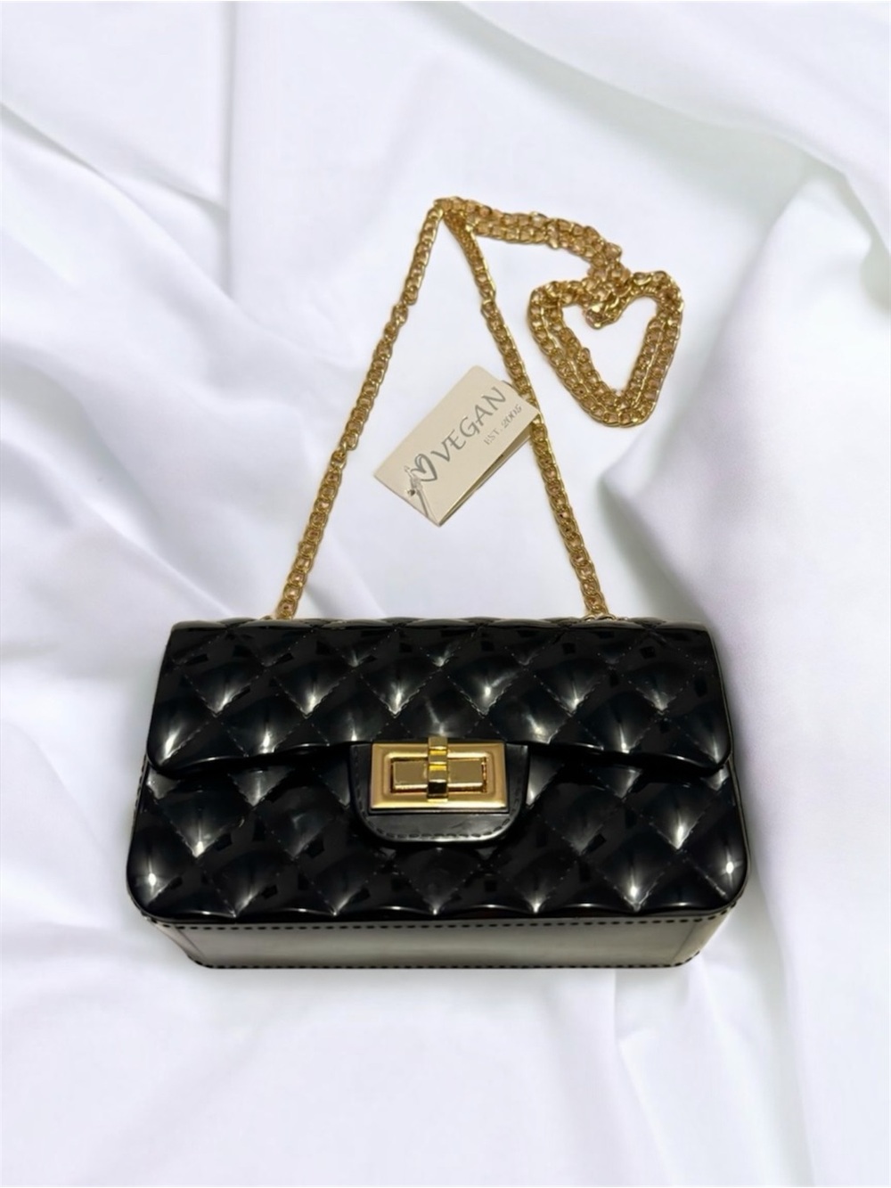 Black Jelly Quilted Compact Handbag With Gold Hardware